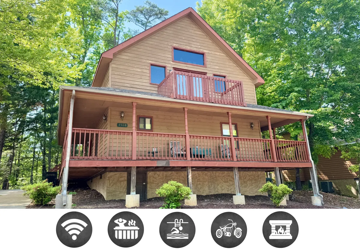 The hero image shows the inviting exterior of a classic mountain home, featuring a spacious front porch with wooden railings, large windows that glow with warmth, and lush green trees surrounding the property. The porch offers a perfect spot to relax and take in beautiful Tennessee sunset views, suggesting comfort and serenity in a natural setting.